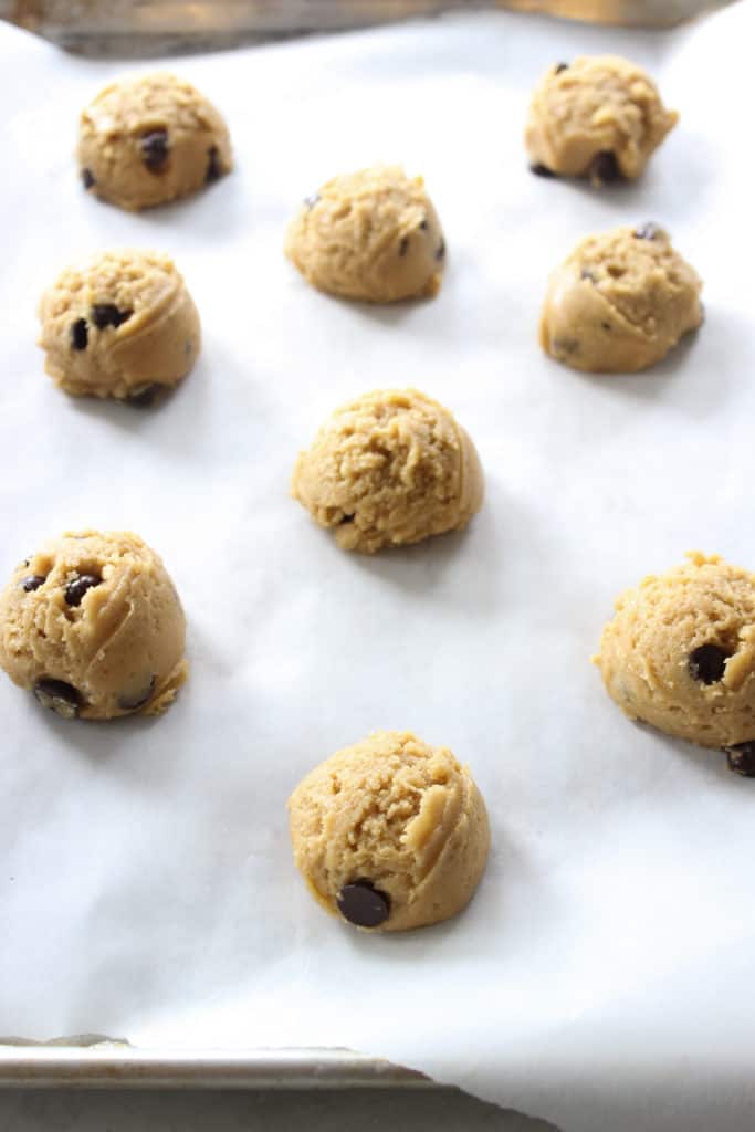 chewy chocolate chip cookie dough balls on parchment paper