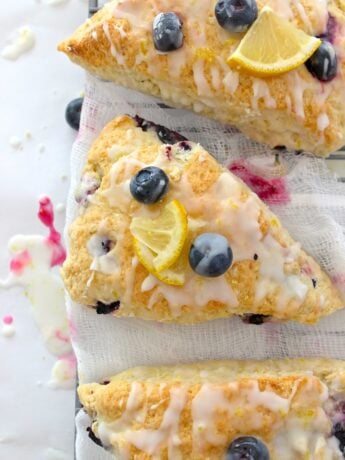 Closeup of blueberry lemon scones sitting on cheesecloth