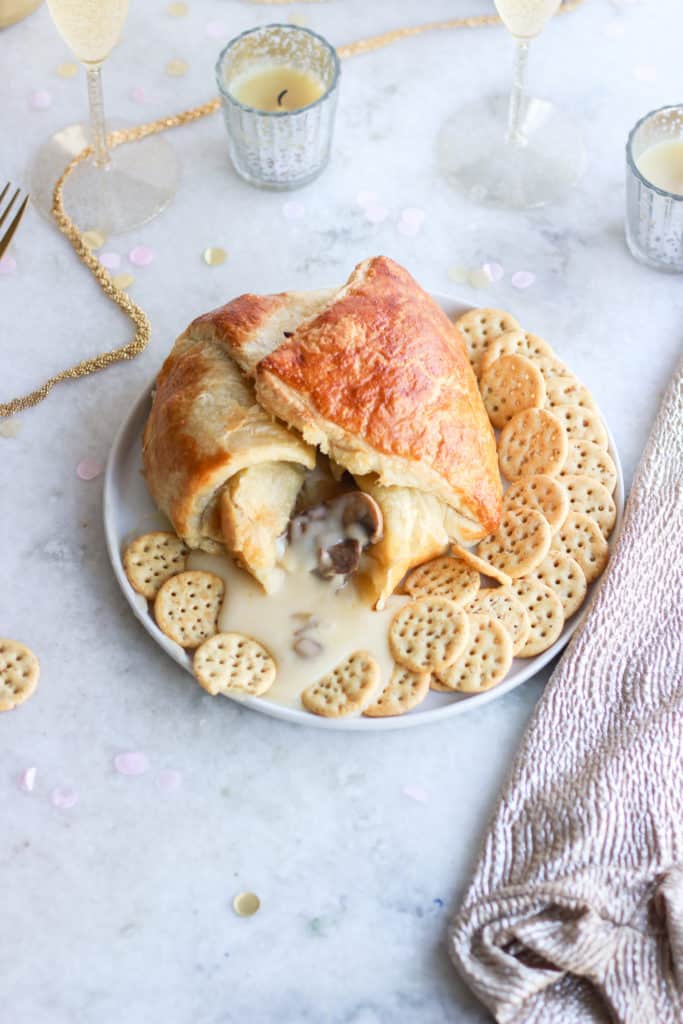 Take your pick of either a sweet or savory baked brie- either way you can't go wrong! #appetizers #bakedbrie #party frostingandfettuccine.com