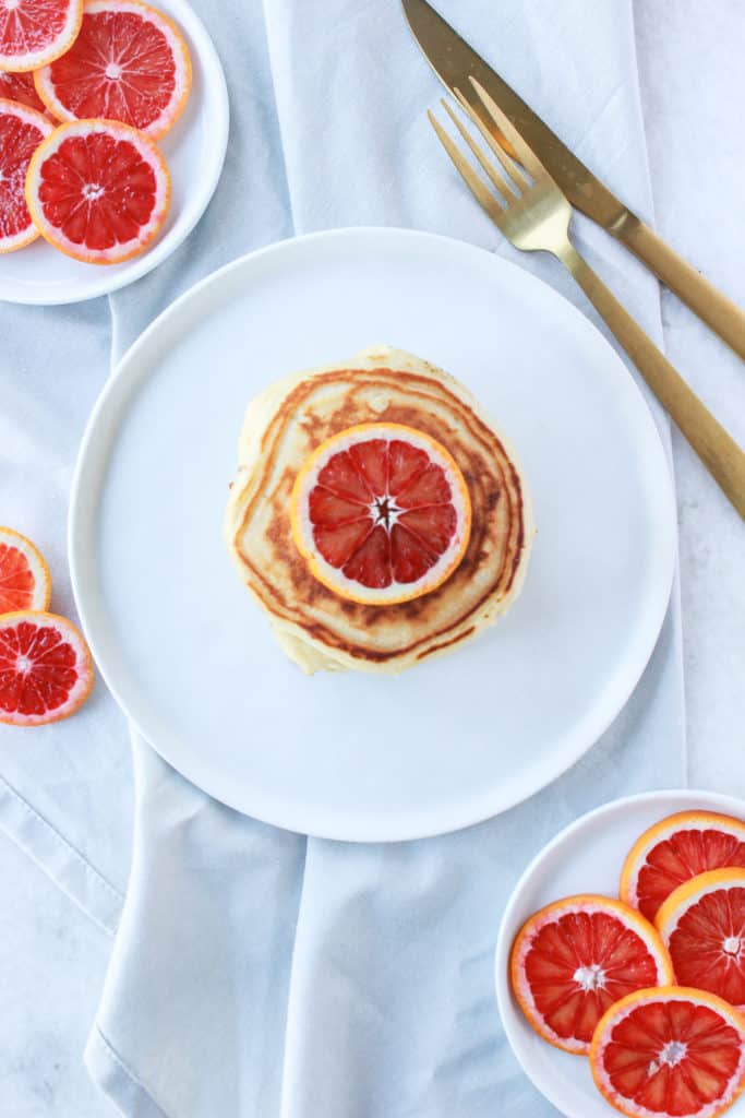  If you're looking for fluffy, easy, stackable, drool worthy pancakes with a hint of citrus, then these are the pancakes for you! #pancakes #bloodorange #fluffy frostingandfettuccine.com