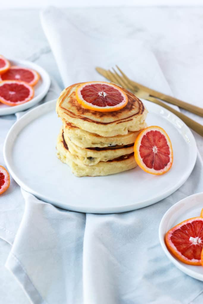  If you're looking for fluffy, easy, stackable, drool worthy pancakes with a hint of citrus, then these are the pancakes for you! #pancakes #bloodorange #fluffy frostingandfettuccine.com