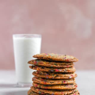 a stack of cookies styled next to a pink background