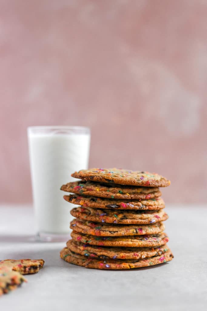 a stack of cookies styled next to a pink background