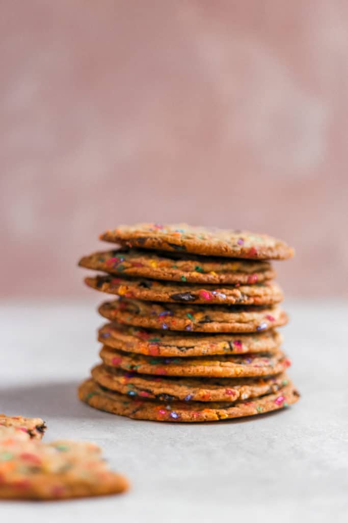 a stack of cookies styled on a pink background