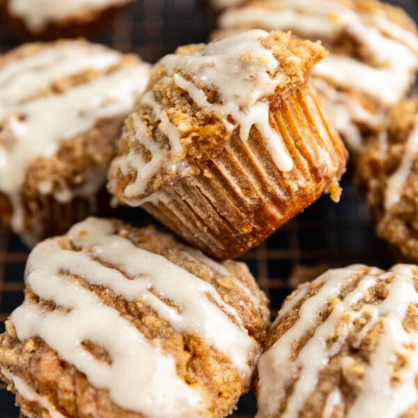 Carrot cake muffins stacked on each other.