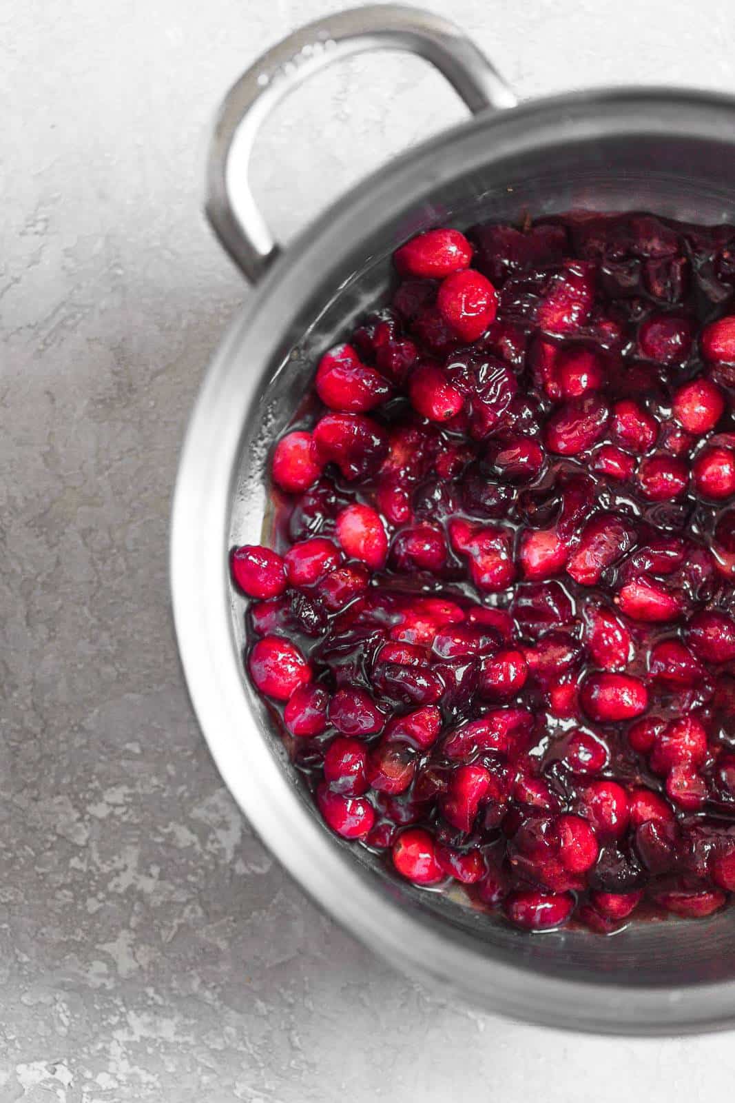 Cranberries cooking in a pot.