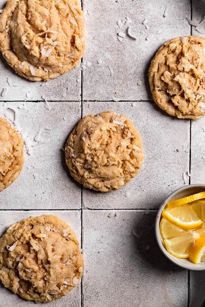 Lemon coconut cookies on a gray tiled surface