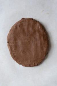 A disk of chocolate cookie dough.