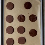 Chocolate cookie dough slices on a sheet tray.