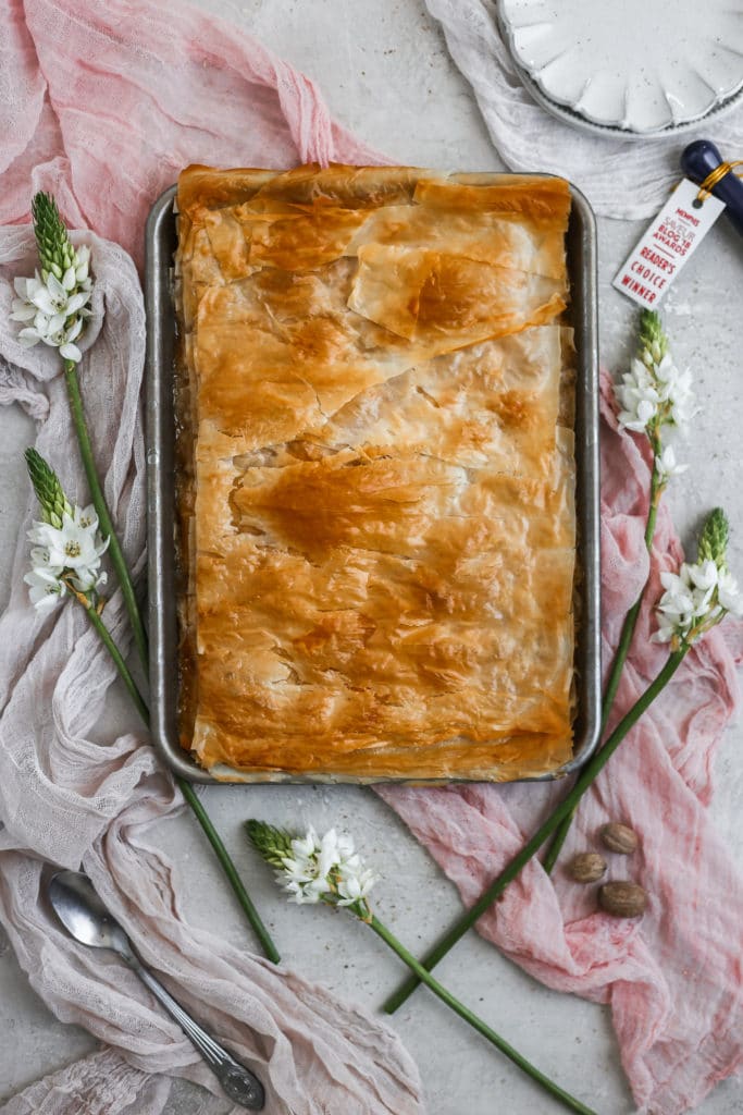 Peach slab pie made with filo dough on a sheet tray