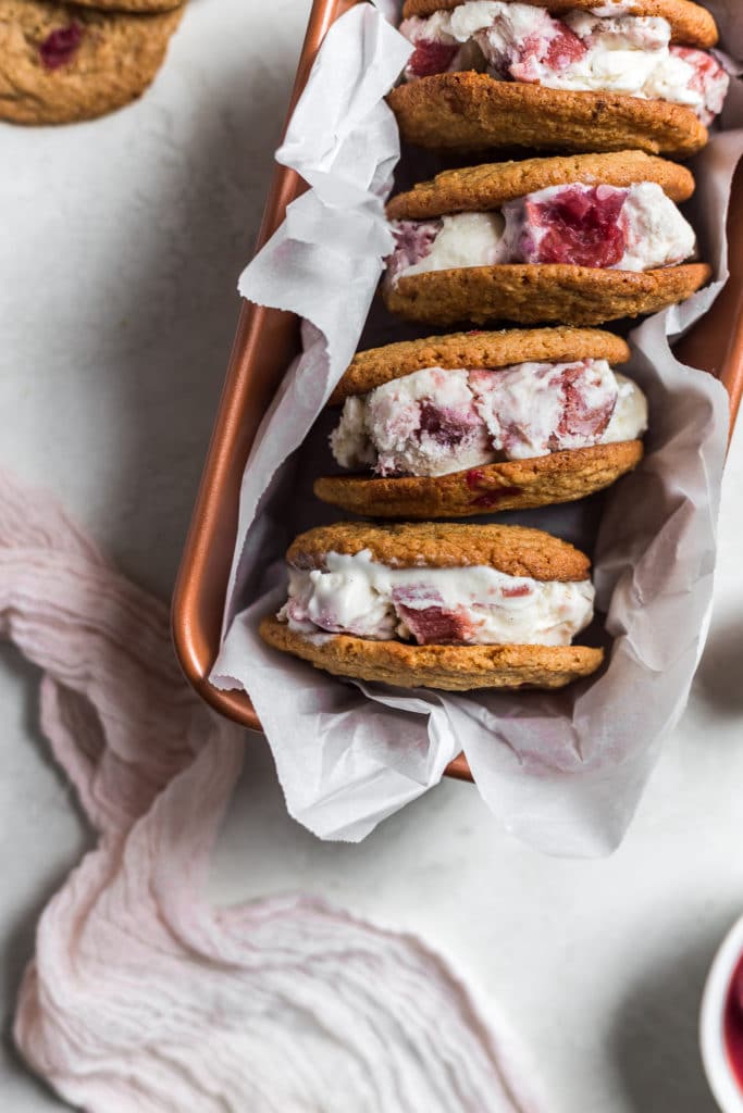 Ice cream sandwiches stacked on their side in a loaf pan.