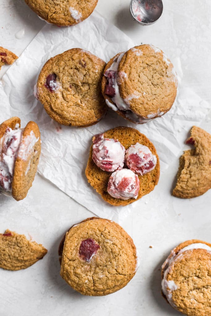 Rhubarb cookies topped with rhubarb strawberry swirled vanilla ice cream.