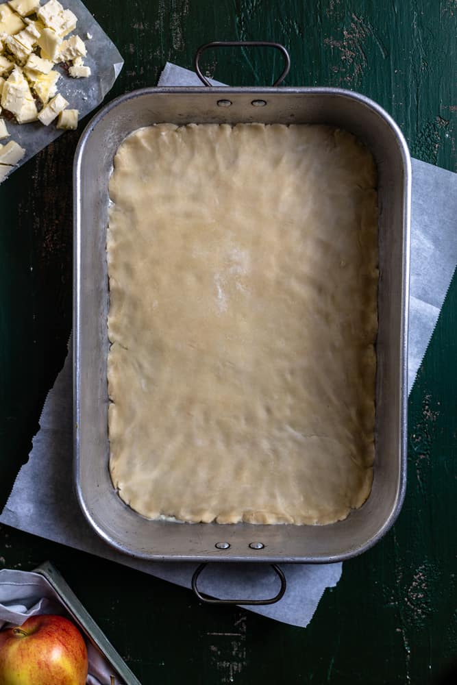 pie dough pressed into a baking pan