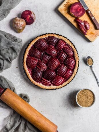 Plums sliced thin and arranged beautifully in a pie crust.