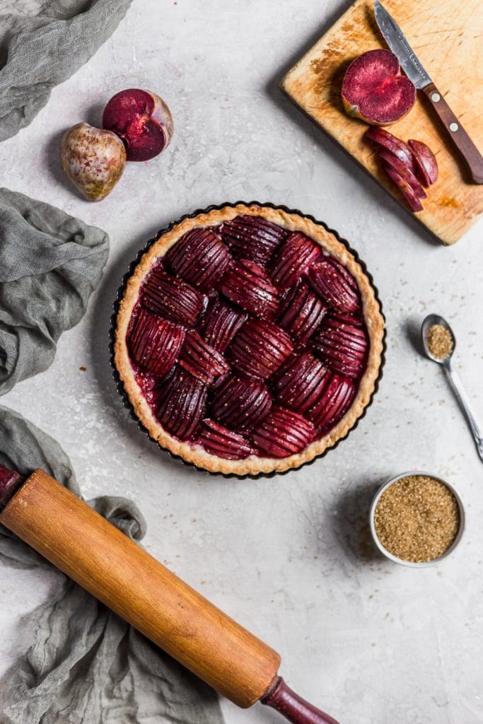 Plums sliced thin and arranged beautifully in a pie crust.