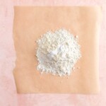 Flour in a pile on brown parchment paper
