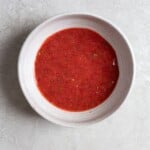 Red puree in a white bowl
