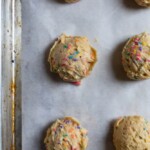Funfetti cookie dough balls on parchment paper