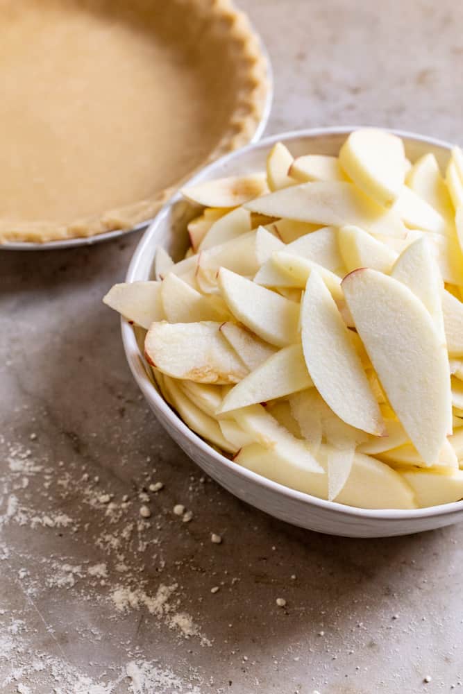 sliced apples in a white bowl