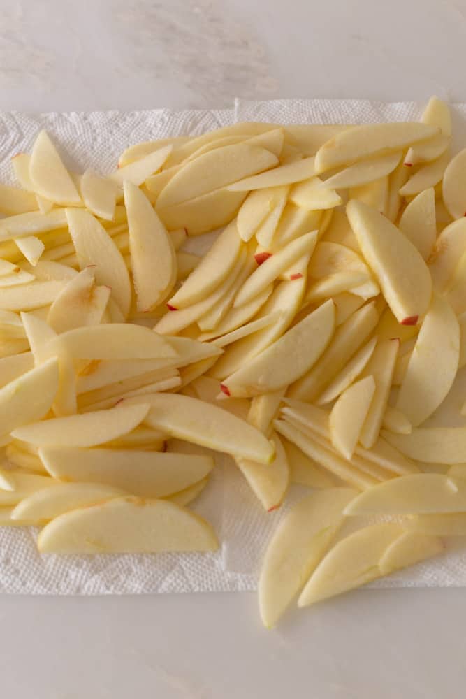 sliced apples drying on paper towels