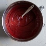 Red batter in a mixing bowl