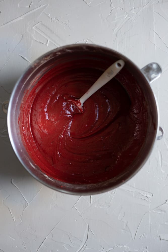 Red batter in a mixing bowl 