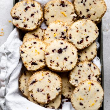 Cranberry orange shortbread cookies lying on a platter