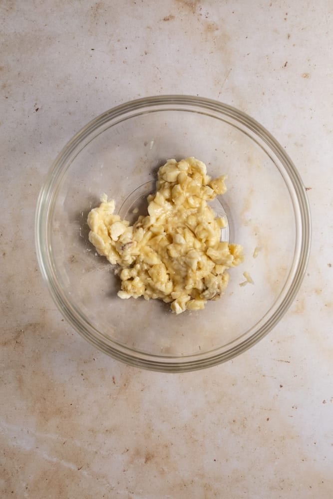 Mashed up bananas in a glass bowl