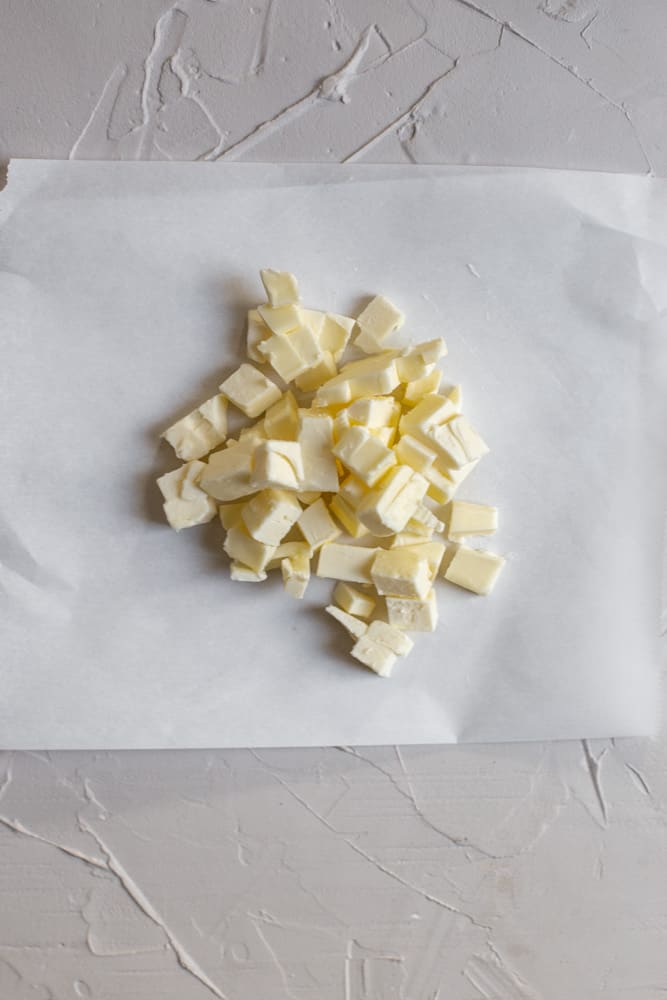 Diced butter on a piece of parchment paper