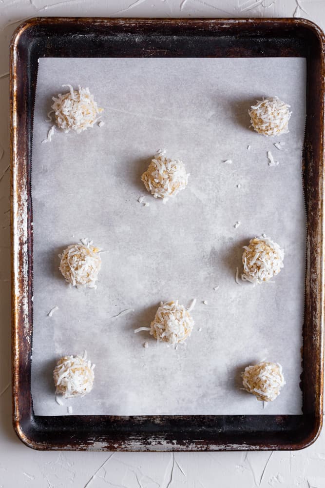 Coconut cookie dough lined on a cookie sheet