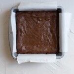 Baked brownies in a parchment line 8x8 pan