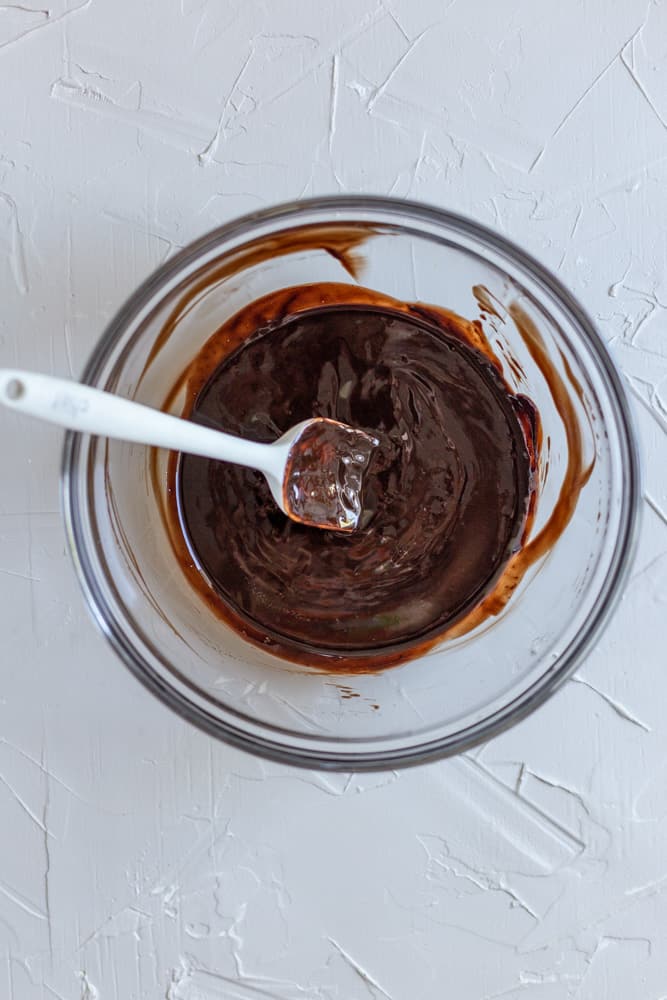 Melted butter and chocolate in a glass bowl.