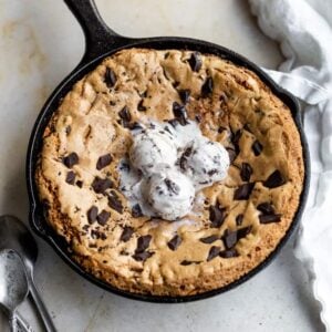 Skillet cookie topped with 3 scoops of ice cream