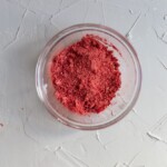 Pulverized freeze dried strawberries in a glass bowl.