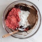 Dry ingredients for strawberry brownies in a large glass bowl.
