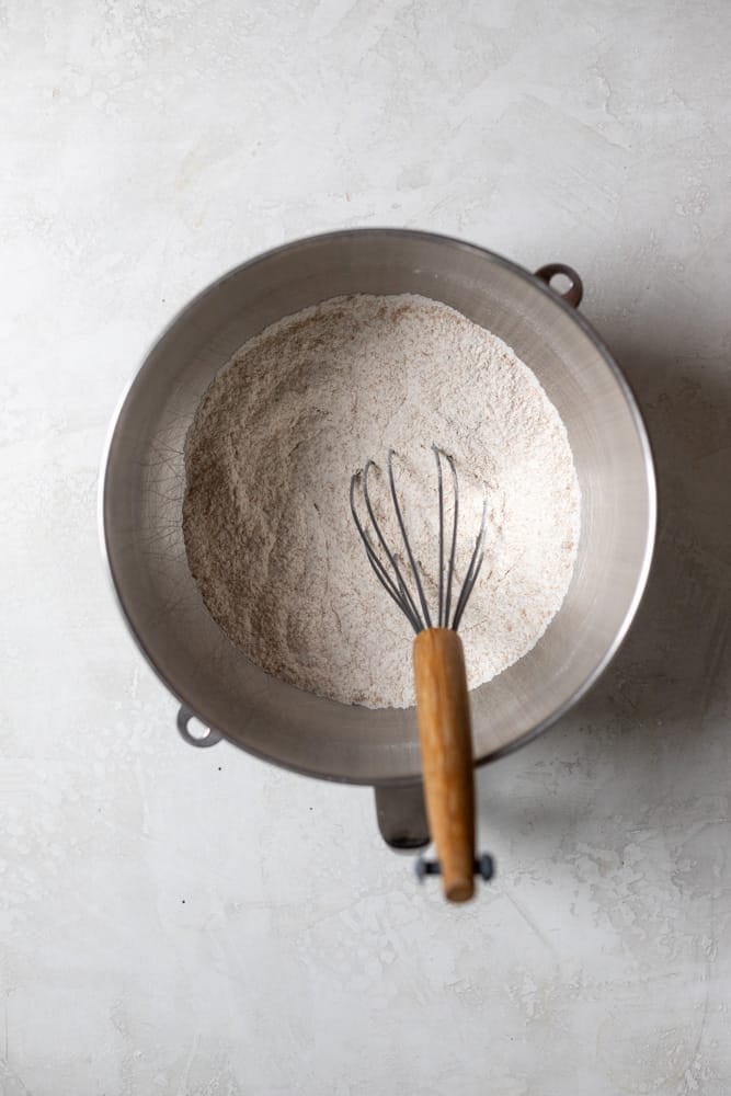 Dry ingredients whisked together in a stainless steel mixing bowl