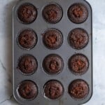 chocolate cupcakes filled with ganache in a 12 pan cupcake tin