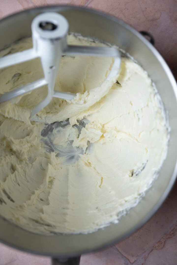 Creamed butter and cream cheese in a mixing bowl.