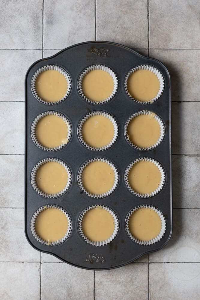 Cupcake batter in a 12 cup muffin tin 