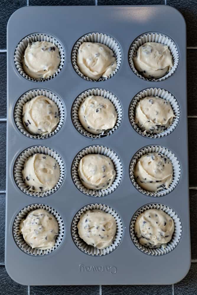 Chocolate chip cupcake batter in a muffin pan