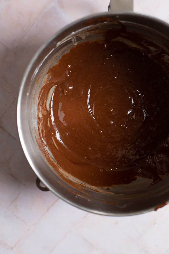 Chocolate cupcake batter in a stainless steel bowl