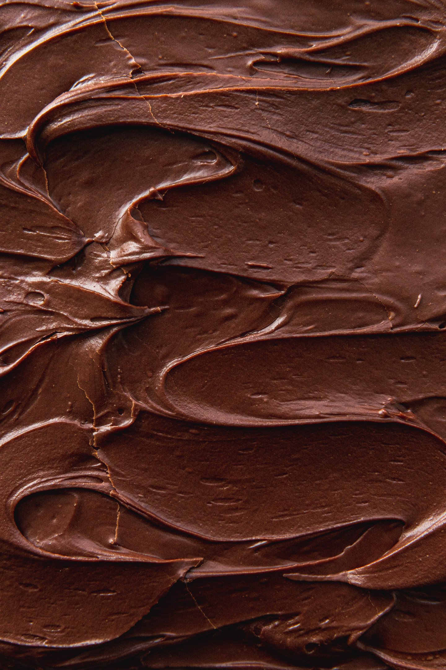 Swirls of brownie frosting.