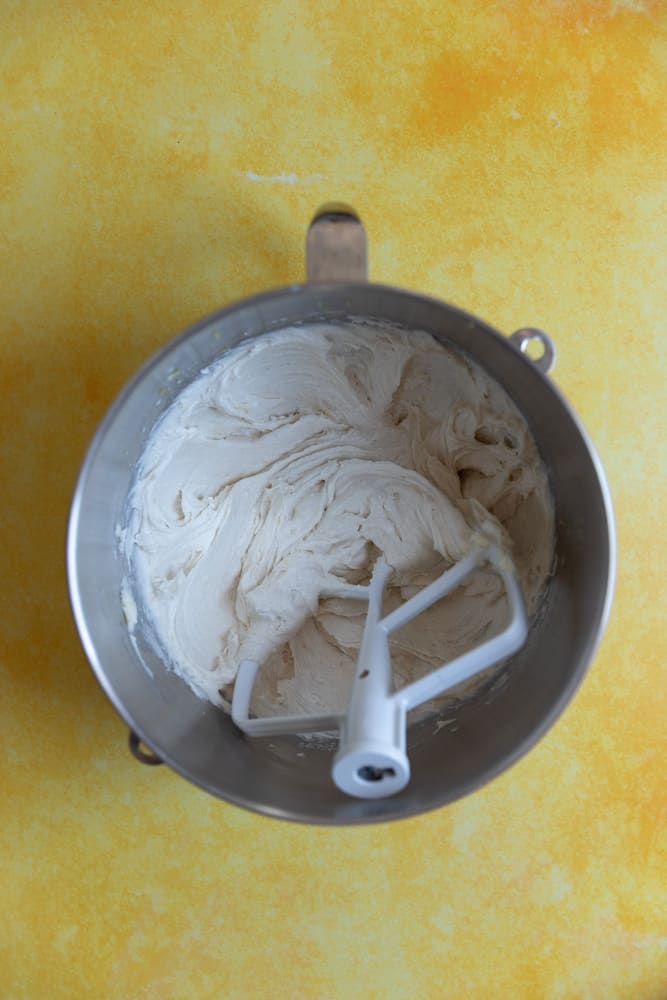 Lemon cupcake batter using a reverse creaming method in a mixing bowl. 