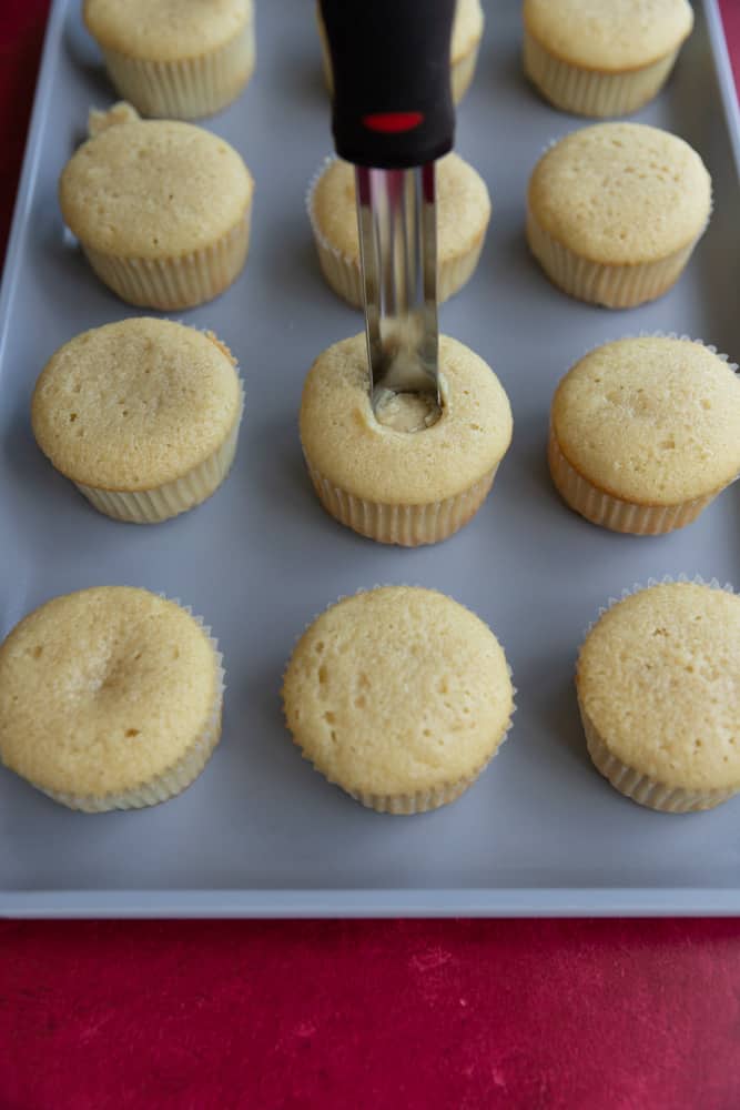 A cupcake with a corer inside the middle.