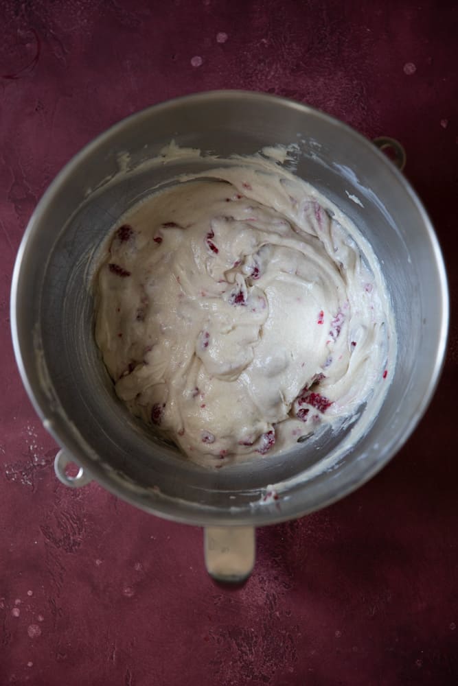 White chocolate raspberry cupcake batter in a mixing bowl.