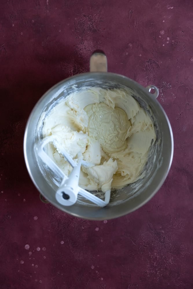 White chocolate, butter, and sugar in a mixing bowl.