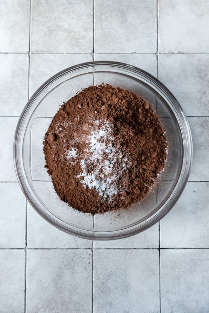 Chocolate cake dry ingredients in a glass bowl.