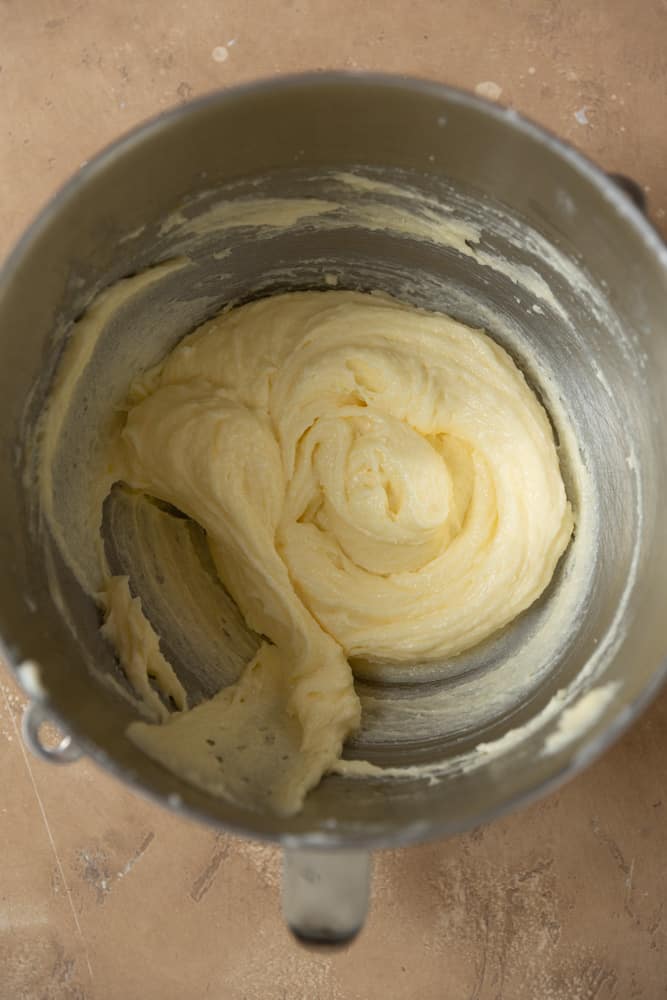 The addition of eggs and oil to creamed butter and sugar. 