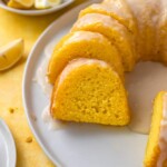 Slices of lemon bundt cake on a round white plate.