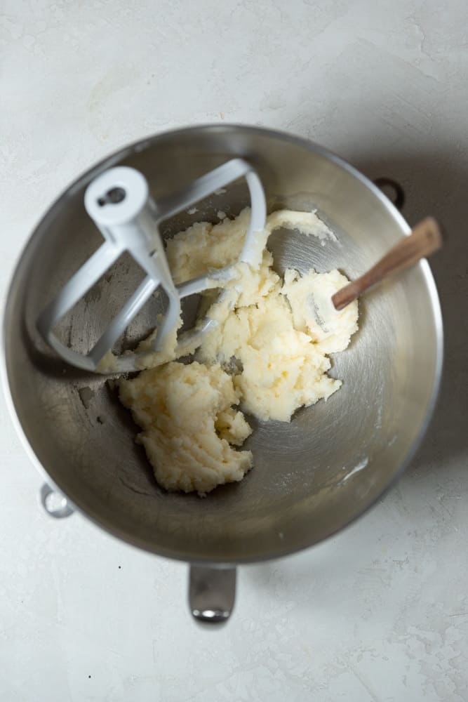 Creamed butter and sugar in a stainless steel mixing bowl. 